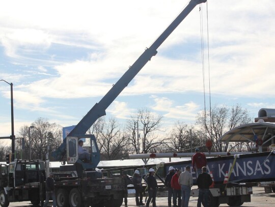 Crews Preparing To Lift The Sign