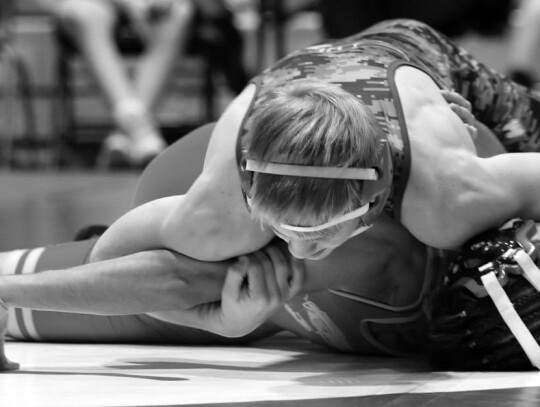 Evan Coble Works To Pin Jayhawk-Linn Opponent